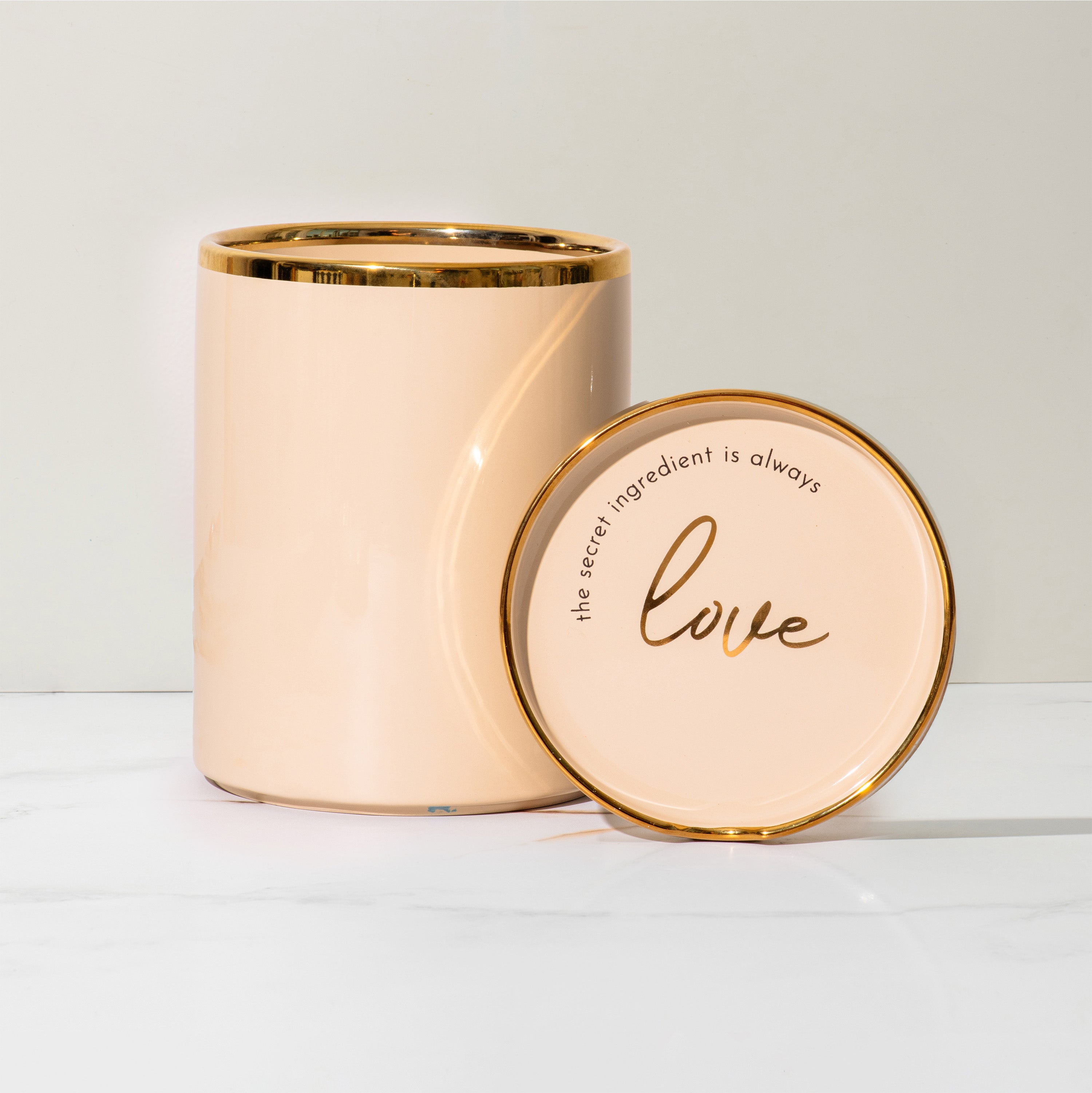 Beige and Gold Utensil Holder with Built-in Spoon Rest