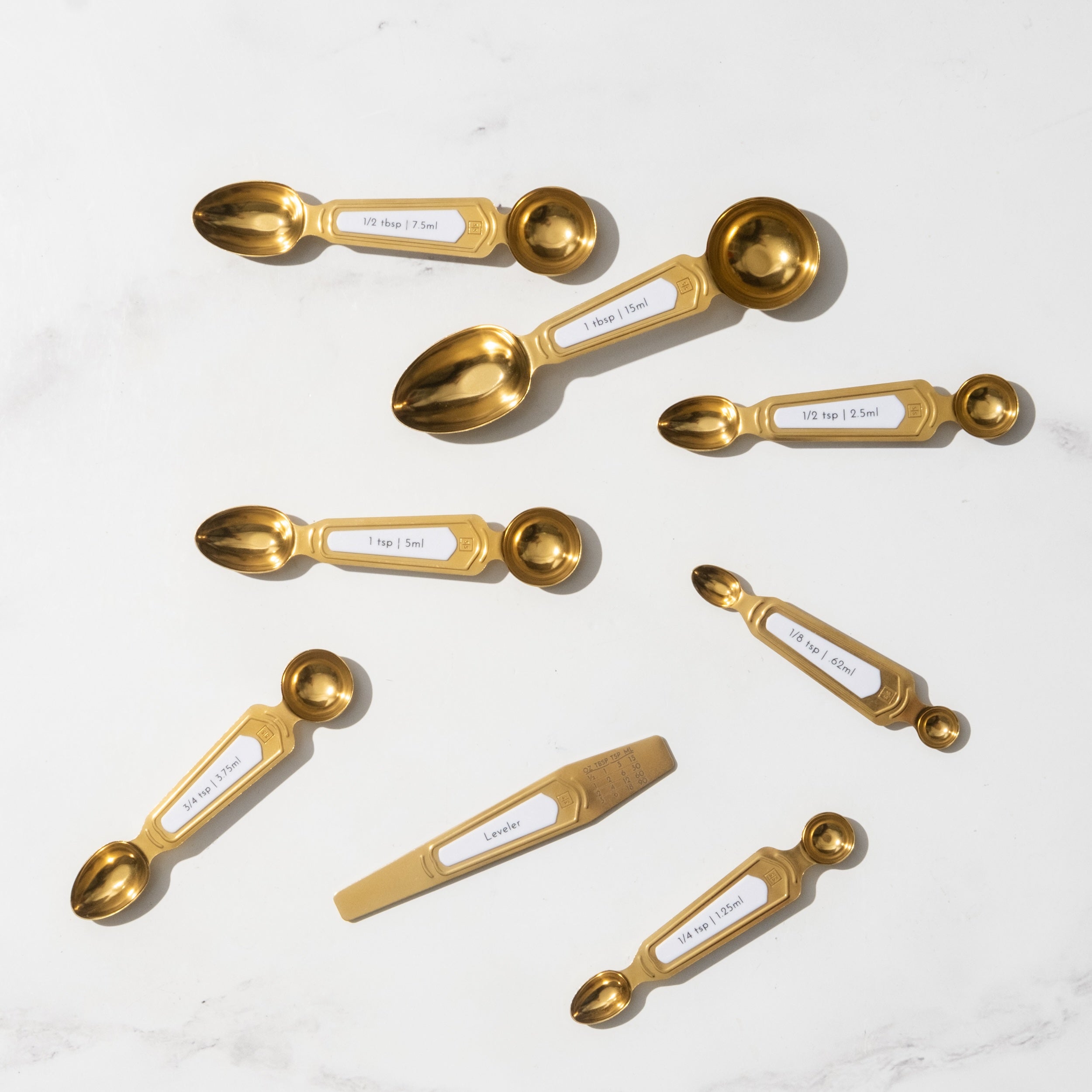 Timeless White and Gold Magnetic Measuring Spoon Set - Styled Settings